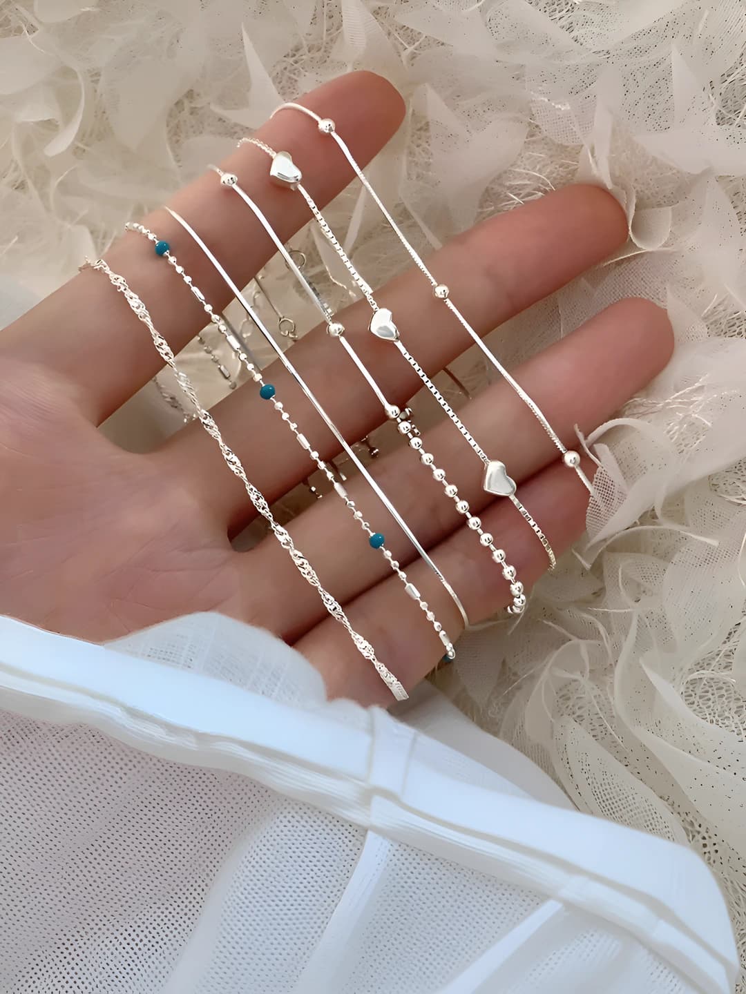 Women's blue geometric bracelet with star and heart design and silver beads