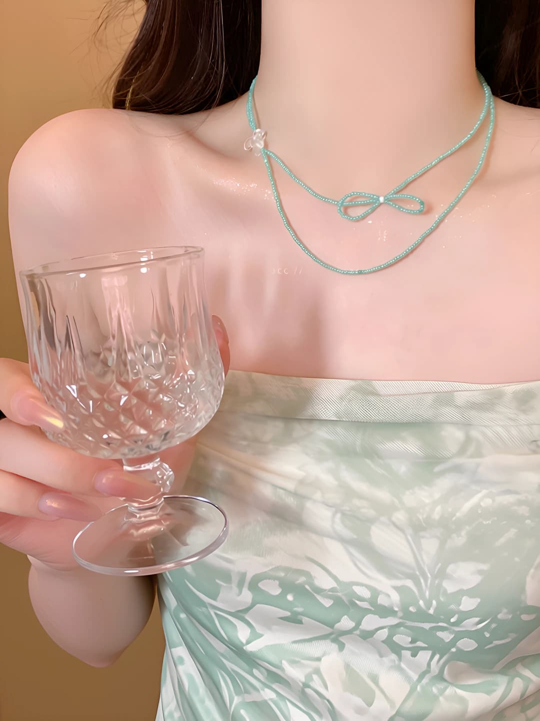 Women's two-layer mint green acrylic beaded necklace with bow design element, clavicle chain