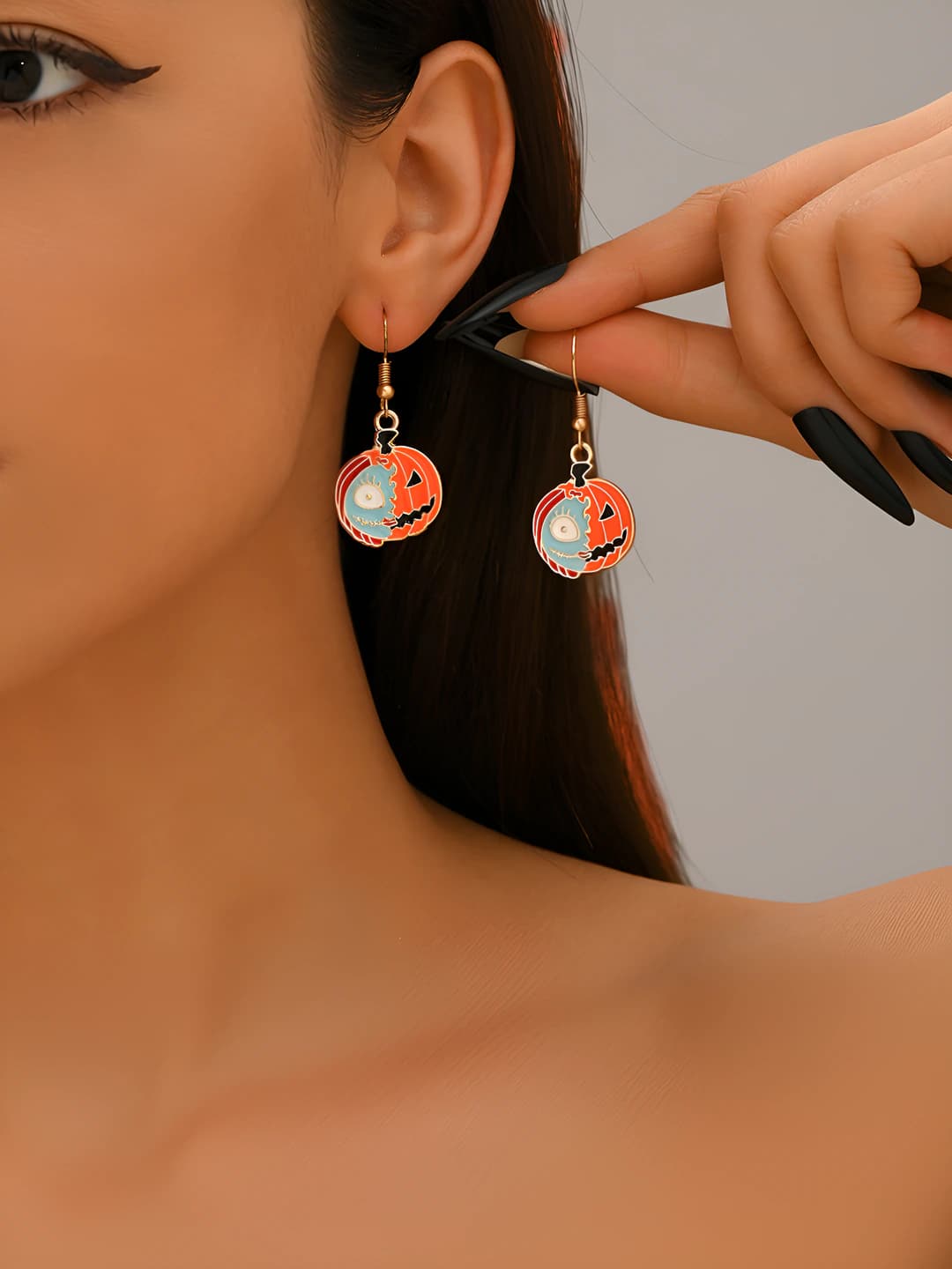 Women's Halloween style earrings with cartoon ghost faces and pumpkins