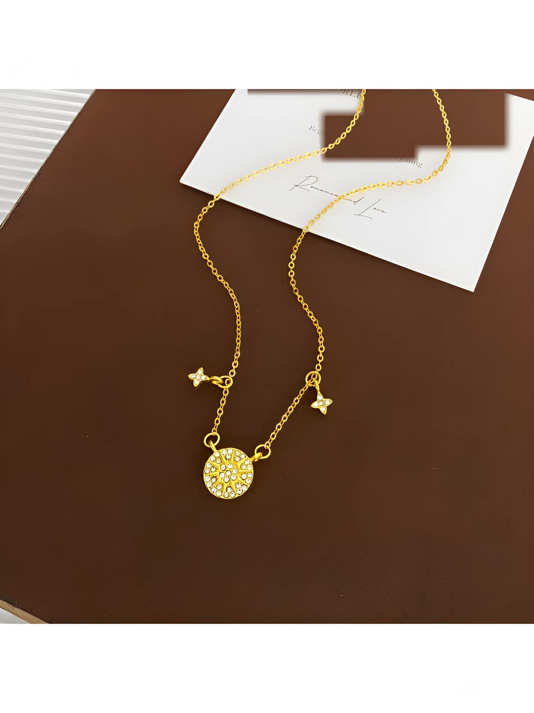 Sun and star necklace