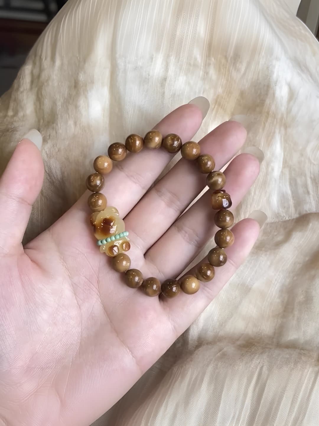 Women's stretch cord bracelet with caramel bear in retro style
