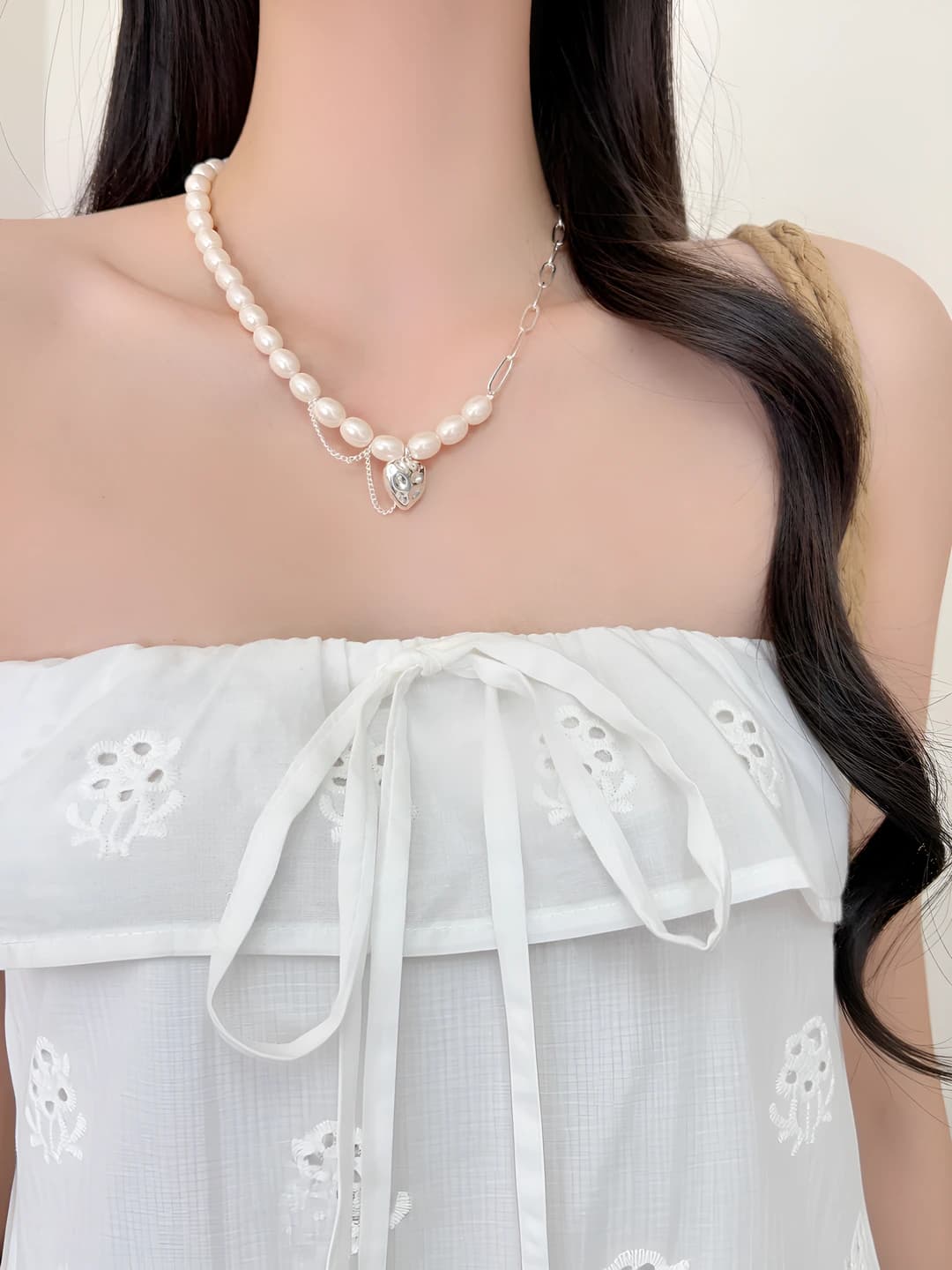 Women's Korean style necklace with white freshwater pearls, silver heart, and geometric chain design
