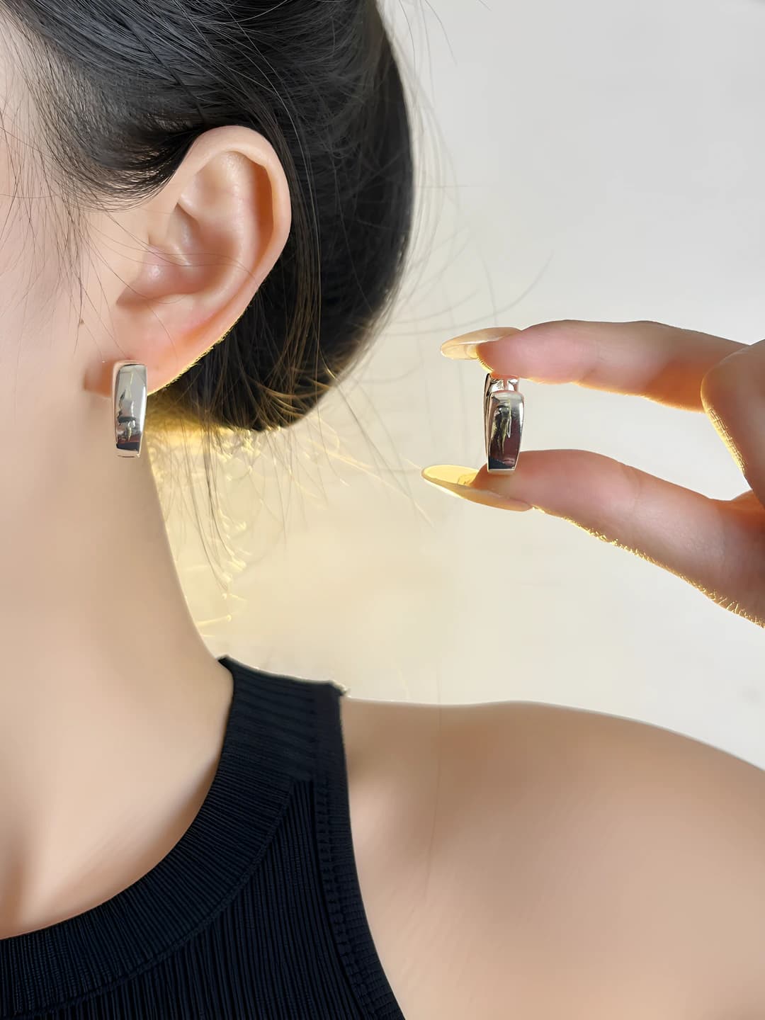 Women's geometric hoop earrings with mirror finish on silver posts