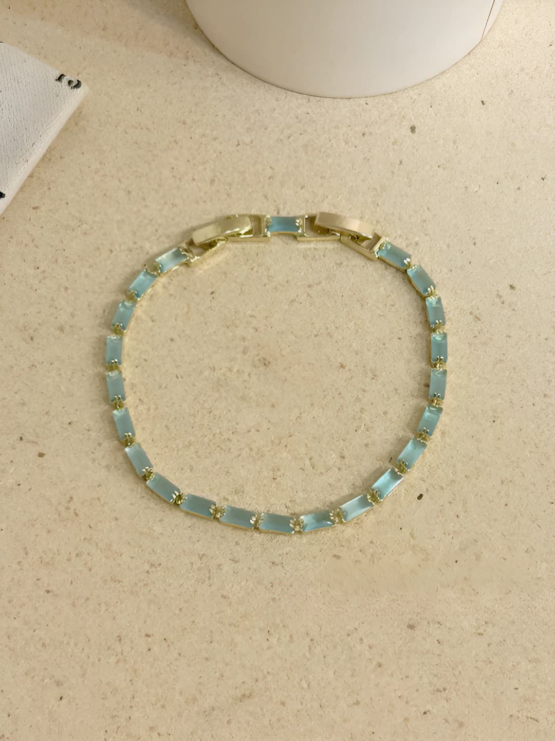 Gold base light blue square bracelet