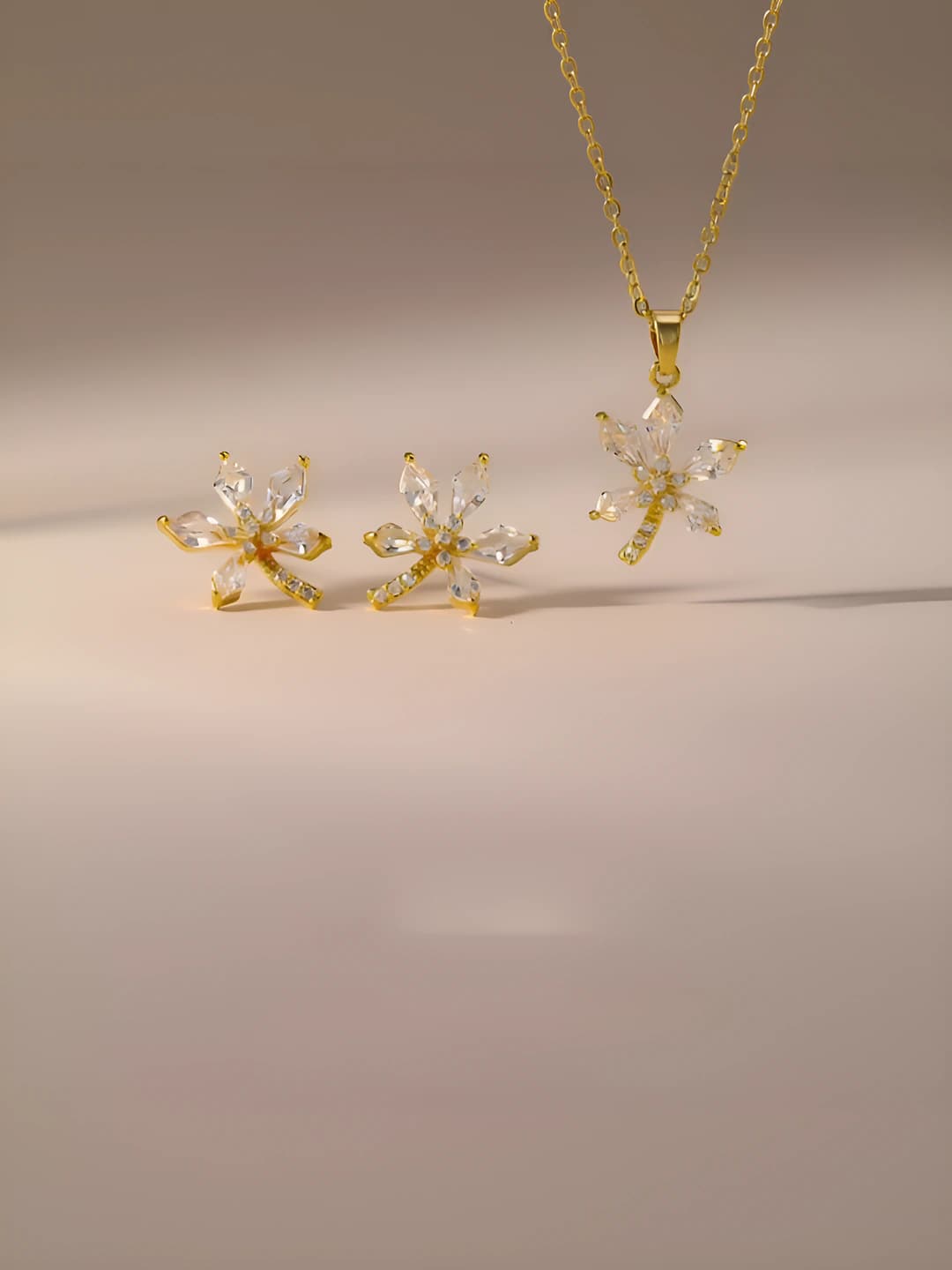 Women's shiny brass earring and necklace set with small animal pattern, colorfast