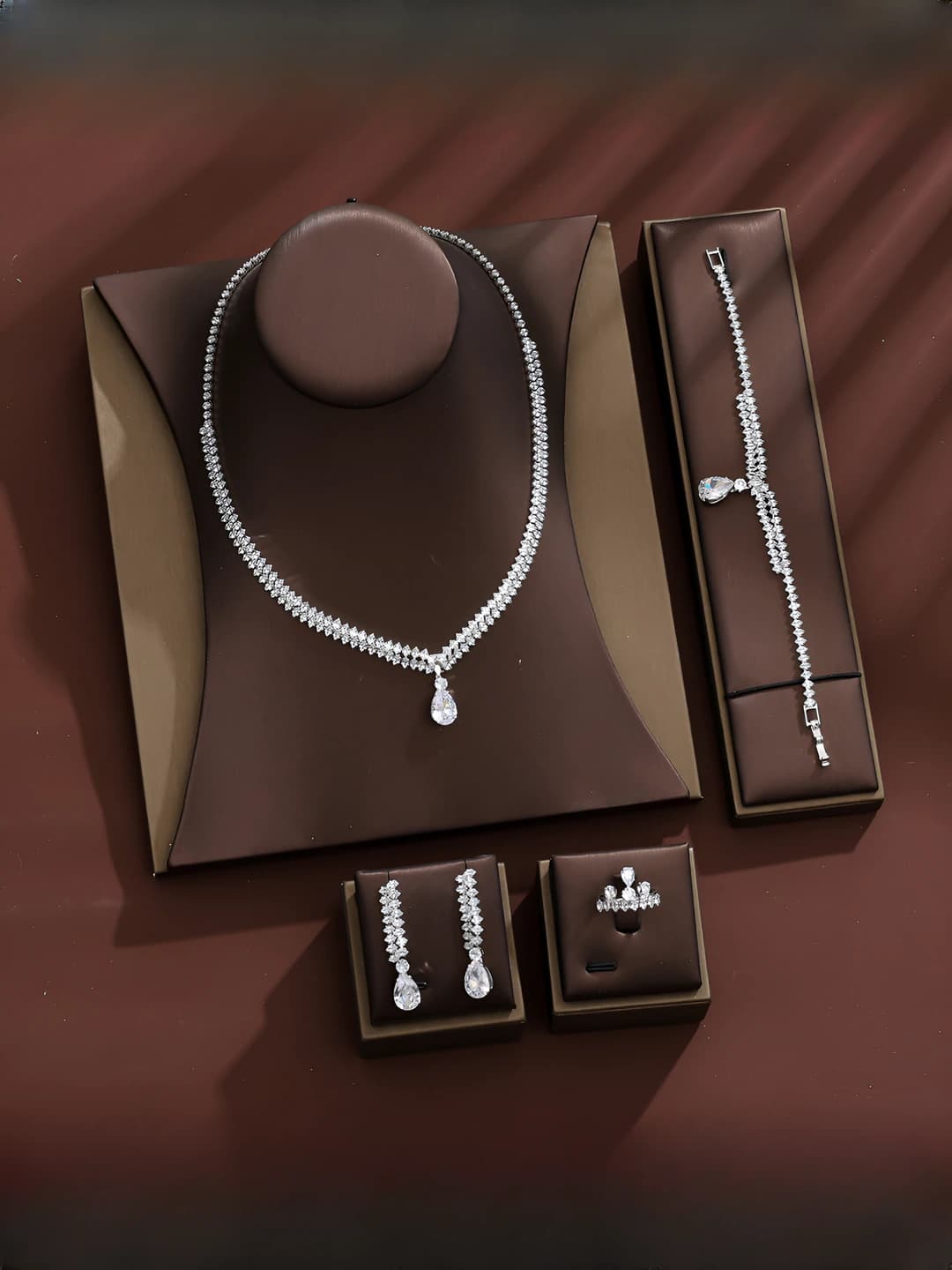Women's zircon set: pendant, earrings, bracelet and ring with drop pattern