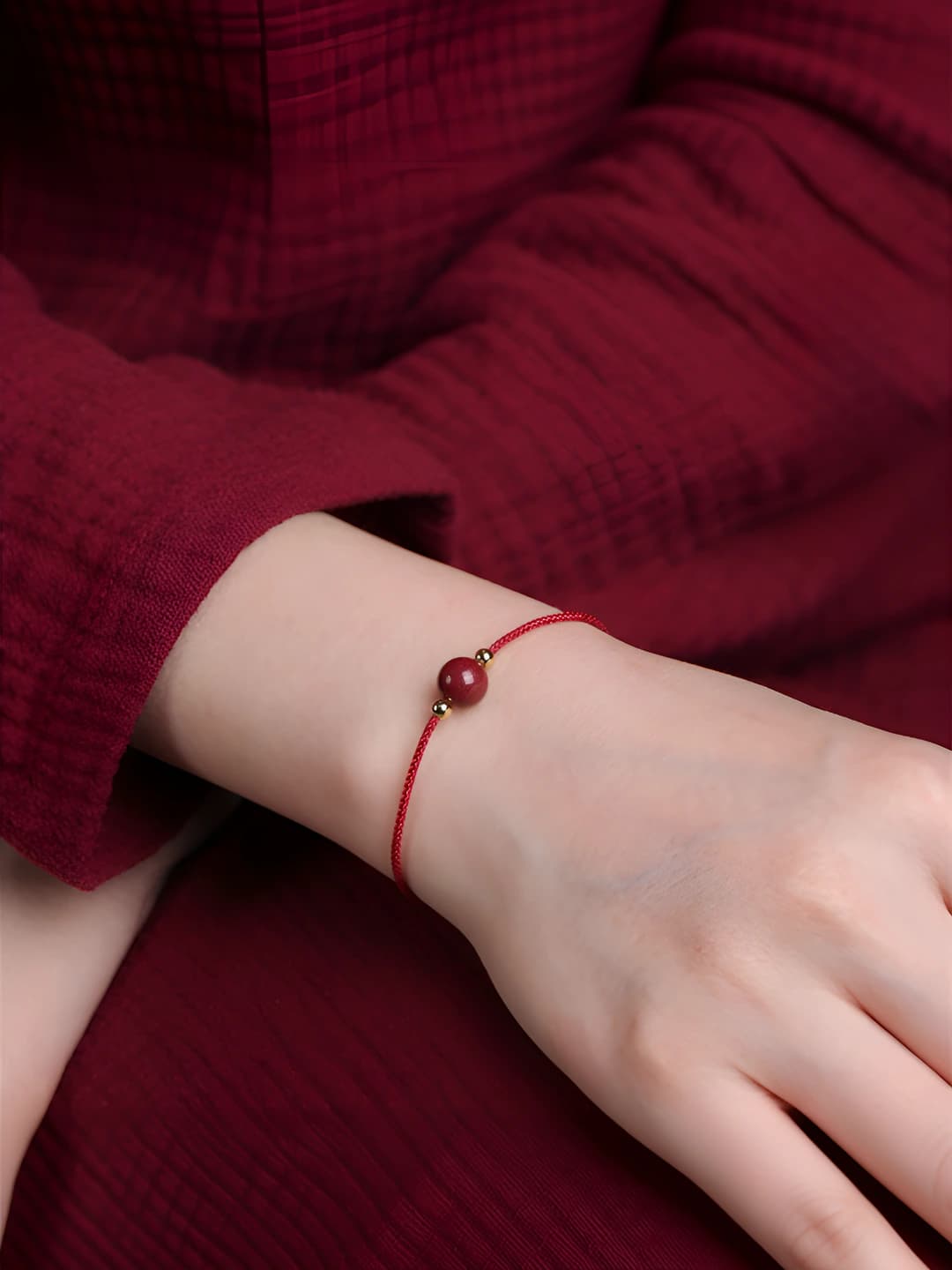 Women's red cord ankle bracelet with lucky beads, retro design element in national style