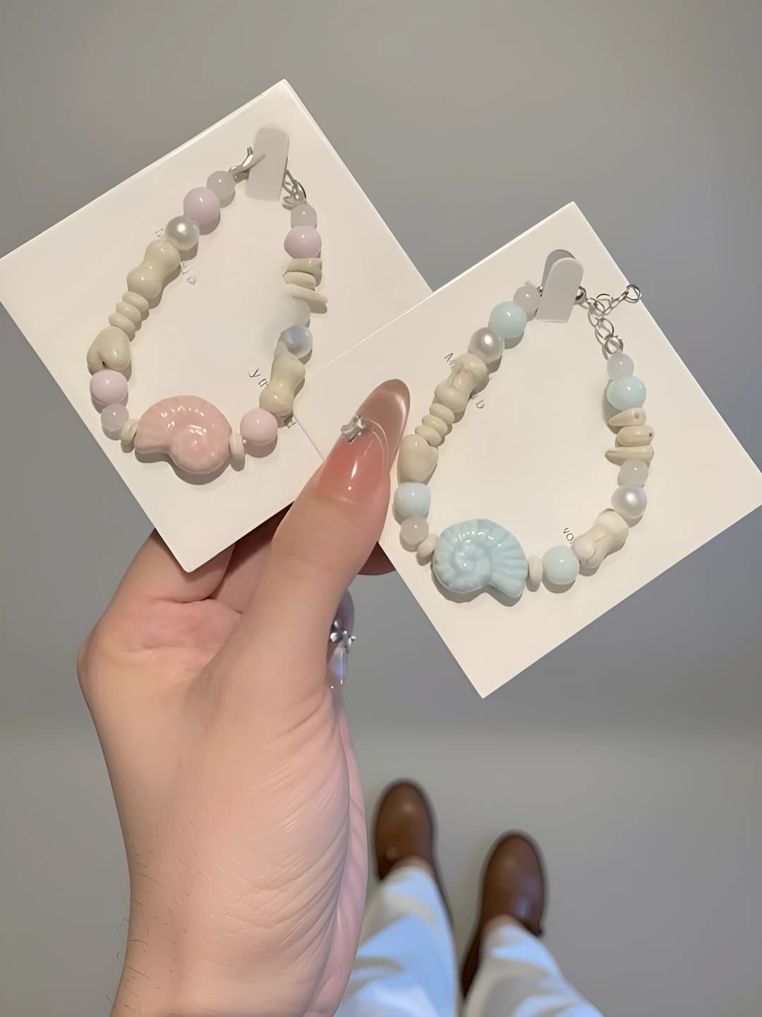Women's pink-blue beaded snail bracelet made of mixed materials with handmade finish