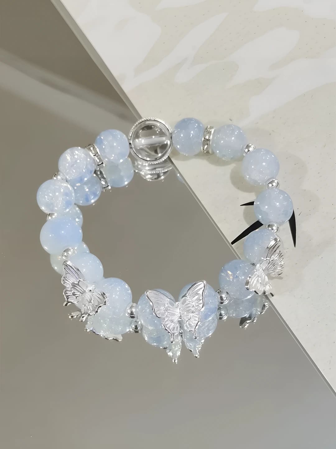 Light blue, icy, butterfly bracelet