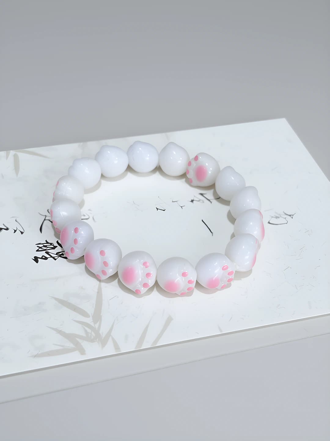 M249 Charred cat paw bracelet, pink