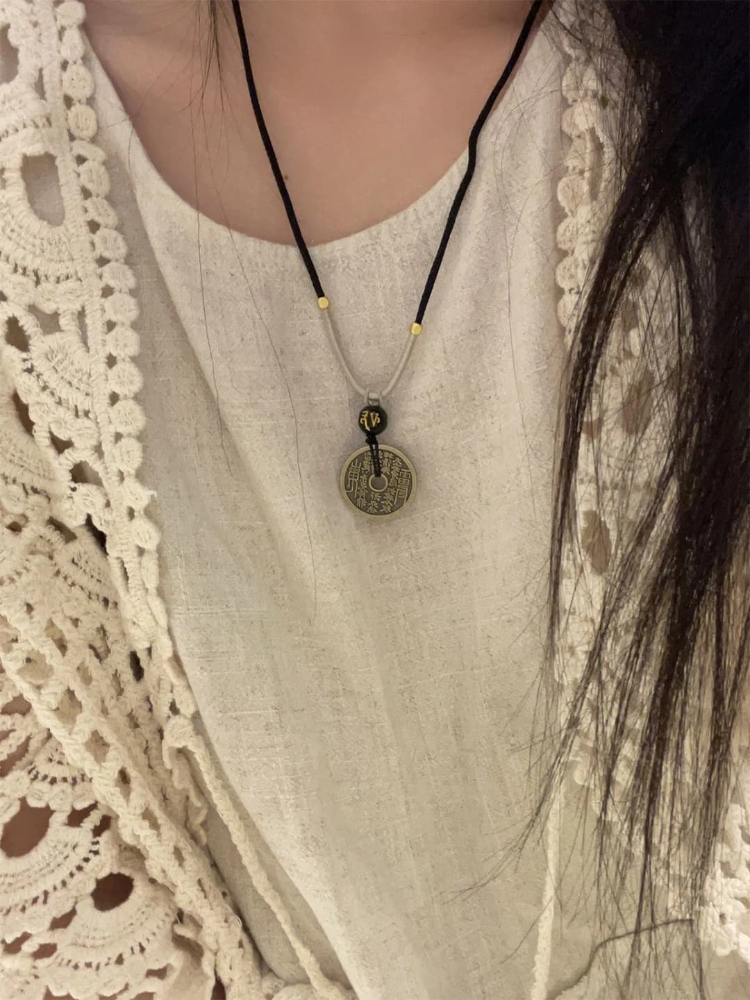 Long chain with bronze coins in retro Chinese national style