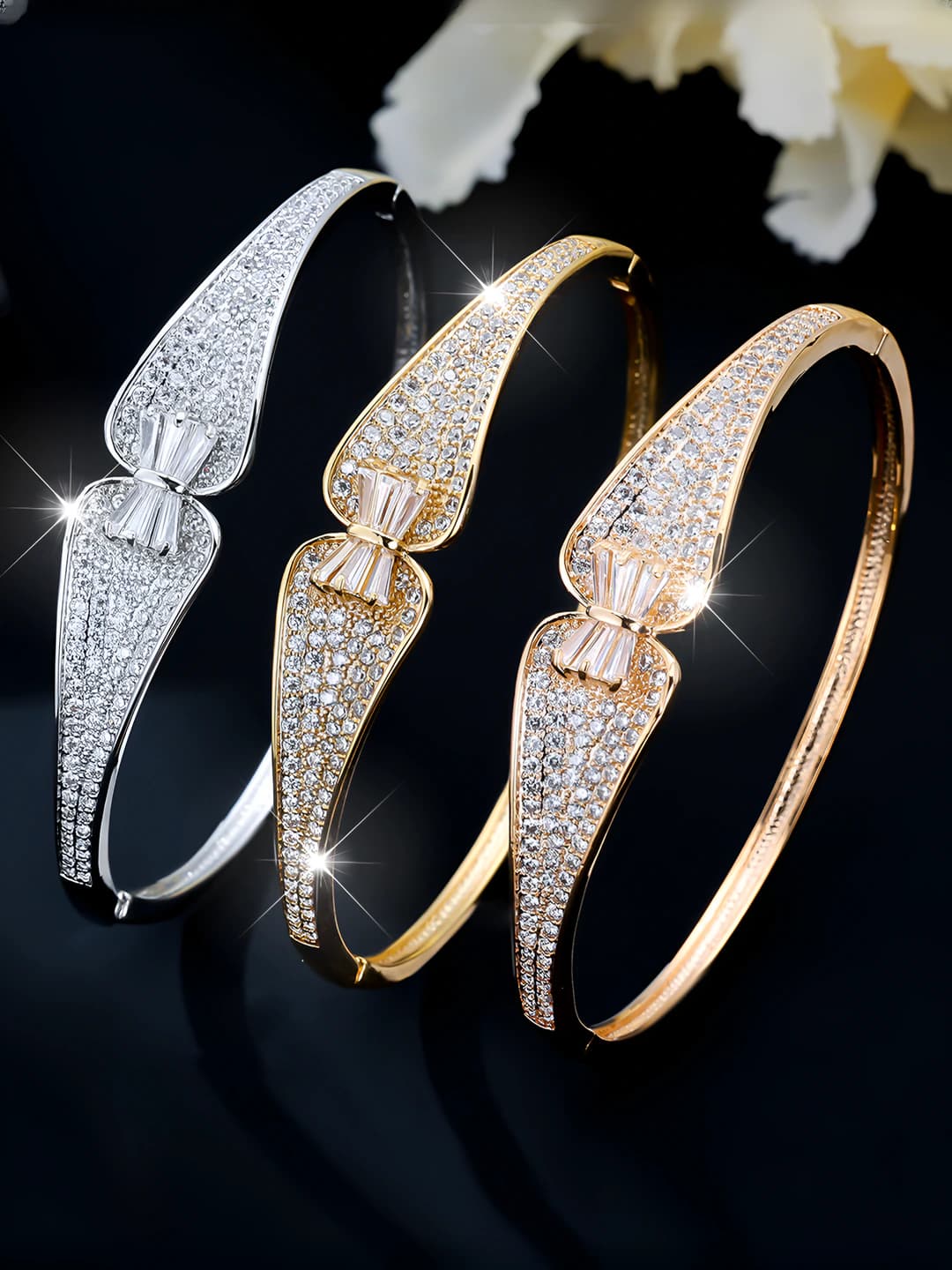 Women's open bangle with zircon, luxury style, design element: bow