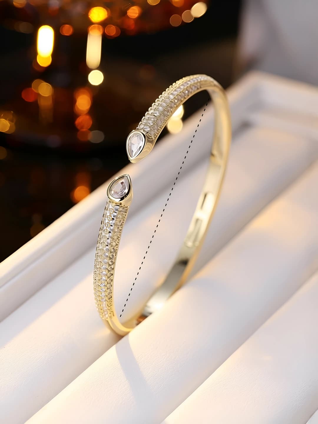 Women's open bracelet with symmetric teardrop zirconia