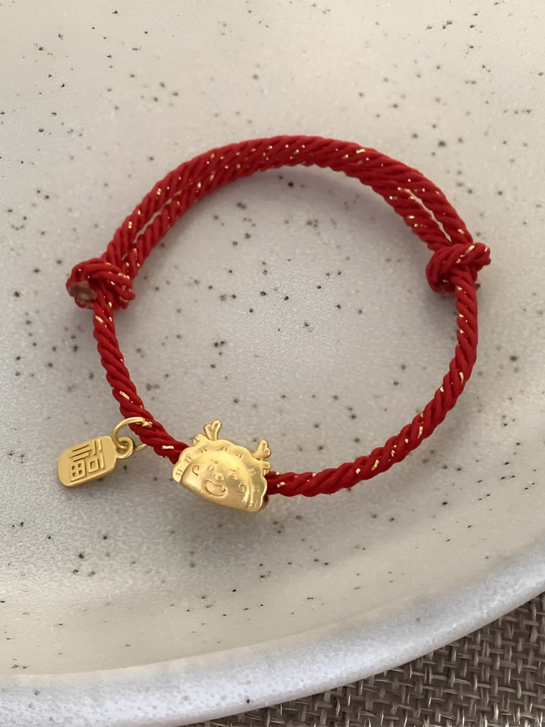Red, gold round, cord