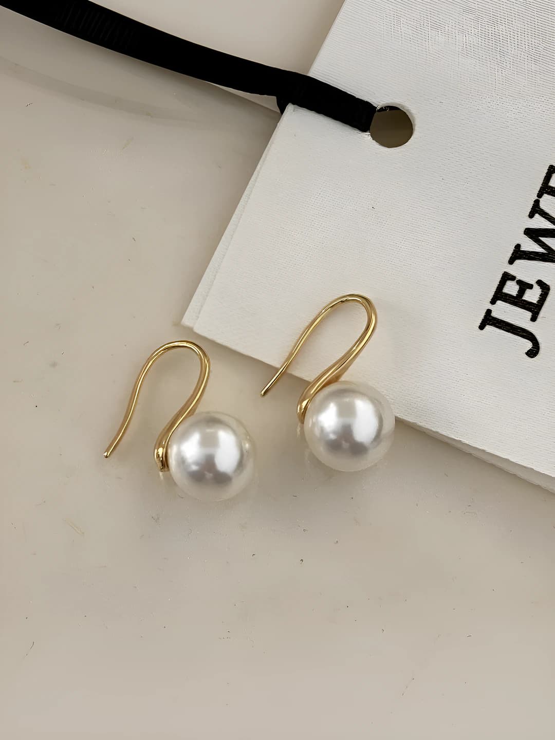 Gold earrings with 10mm white glass pearls