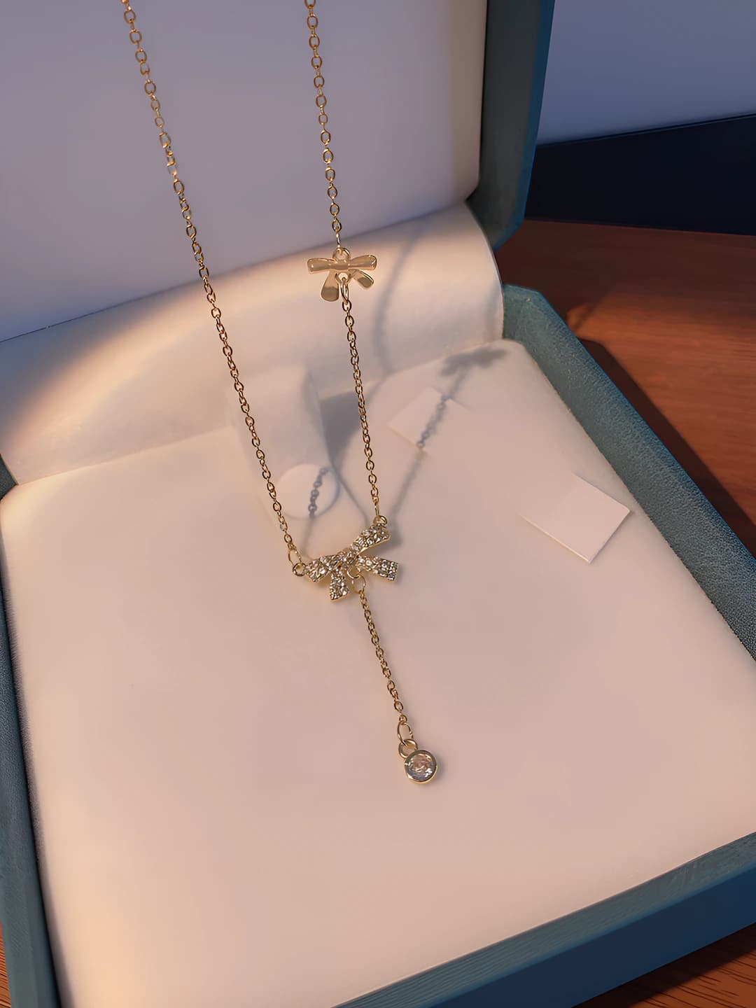 Women's Korean style titanium steel necklace with rhinestones, bow shape with tassels, summer, light luxury