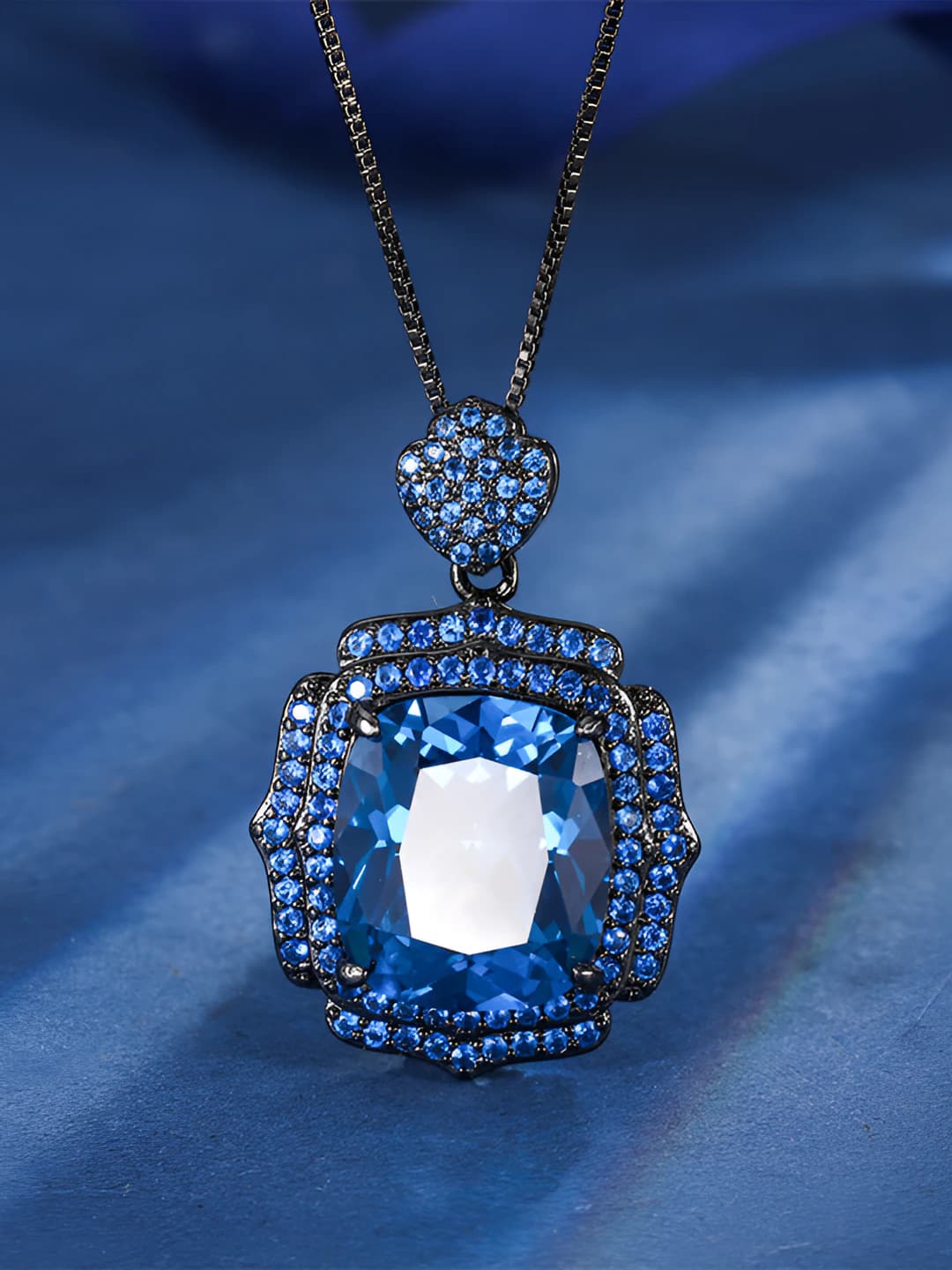 Black-gold blue spinel pendant with chain