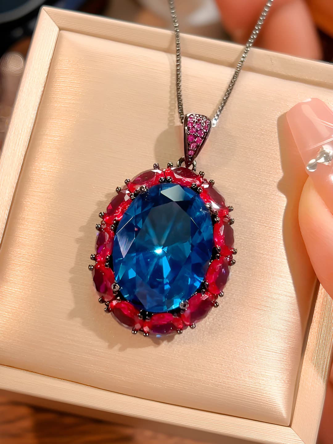Blue spinel pendant with box and chain