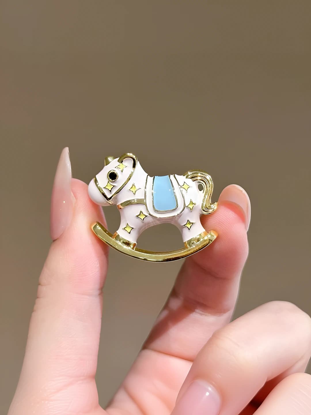 White horse brooch
