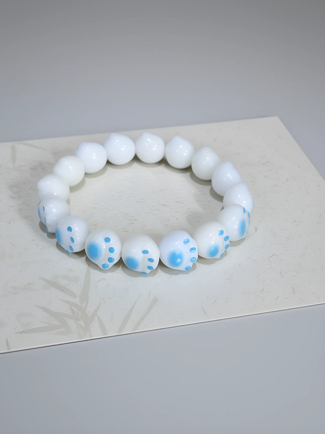 M248 Charred cat paw bracelet, blue