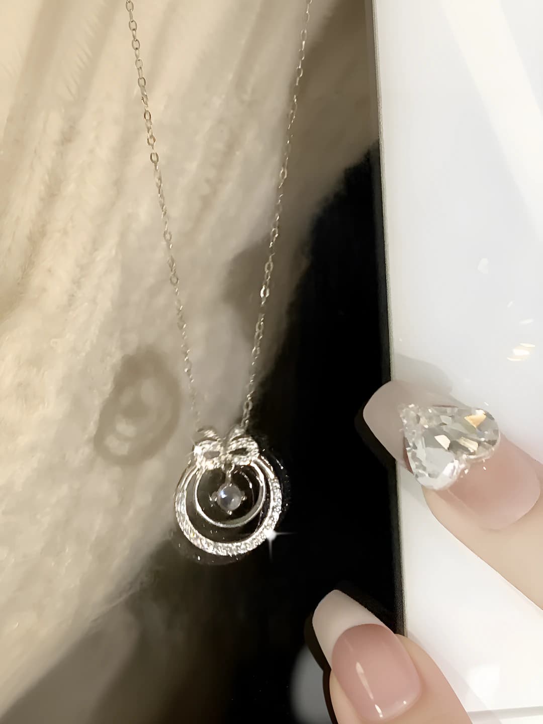 Floral bow necklace, silver