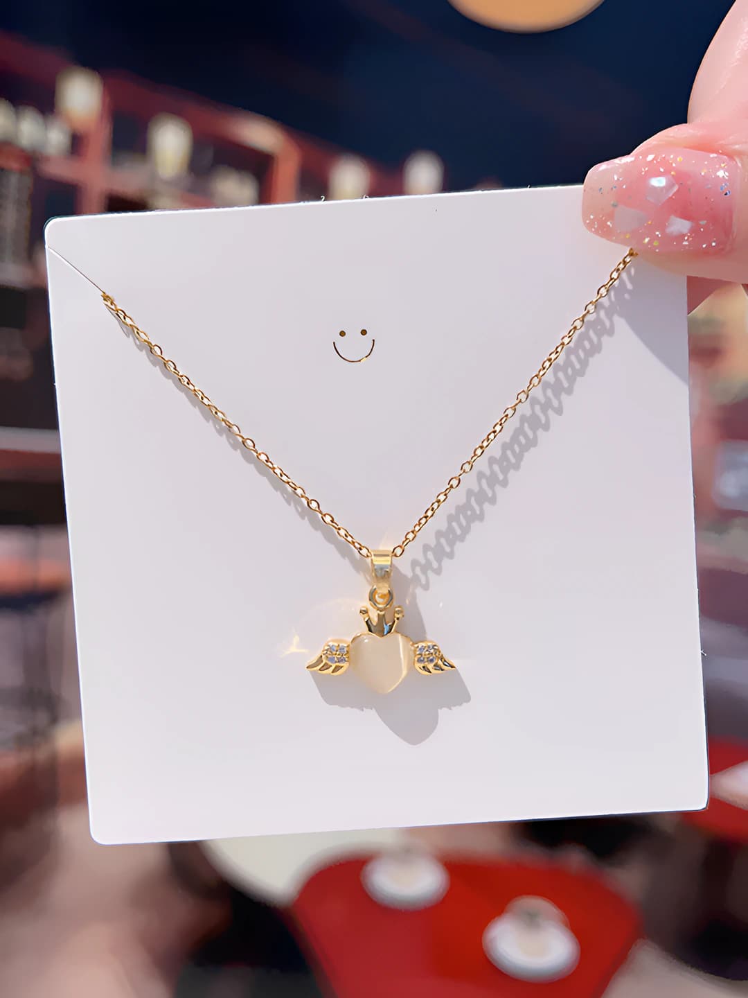 Women's titanium steel choker chain with crystals, wings and heart