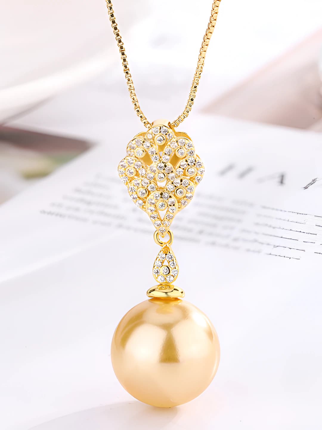 Gold beaded pendant