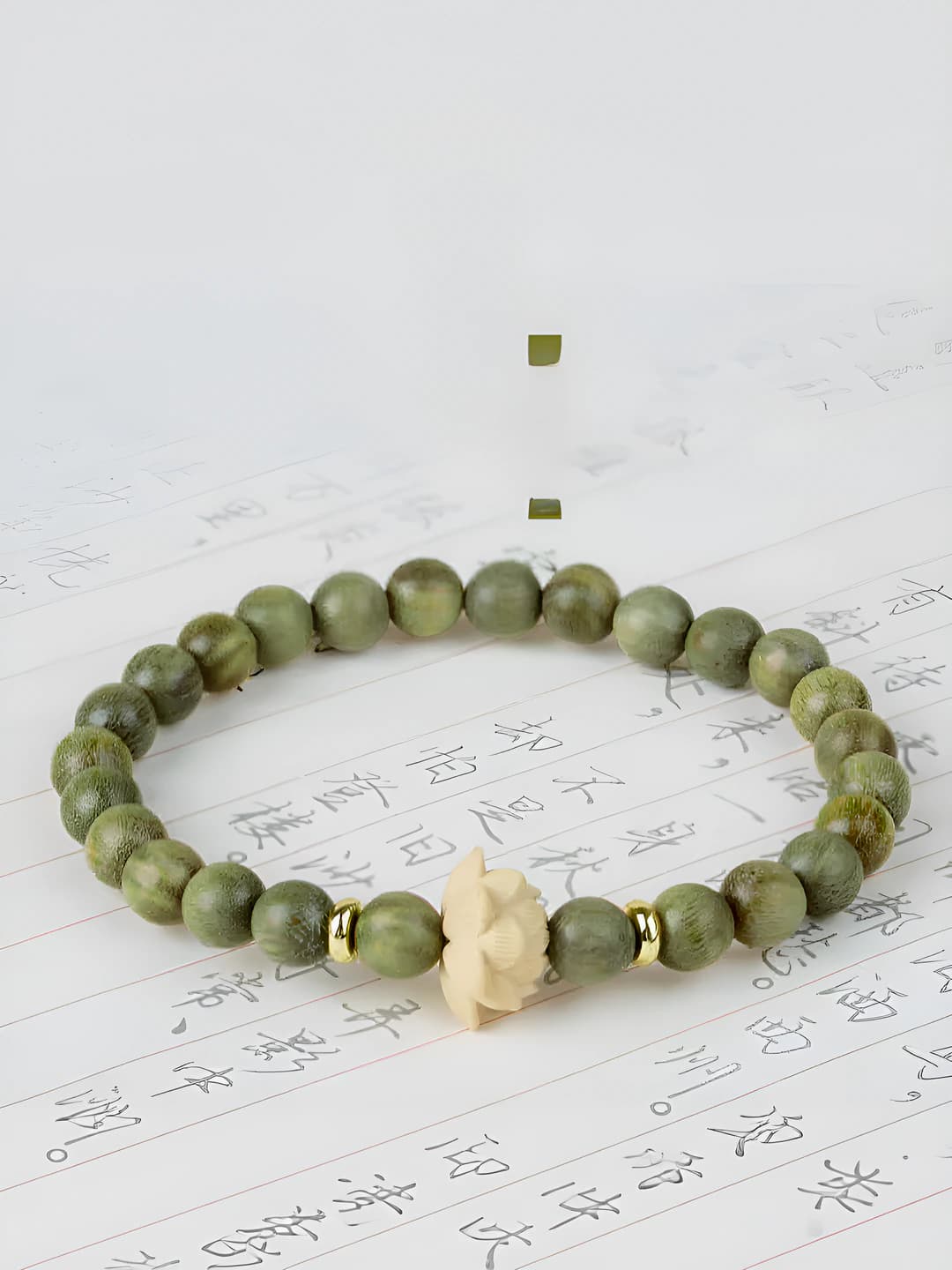 Women's bracelet: handmade green sandalwood and shi seeds, unique design element in antique style