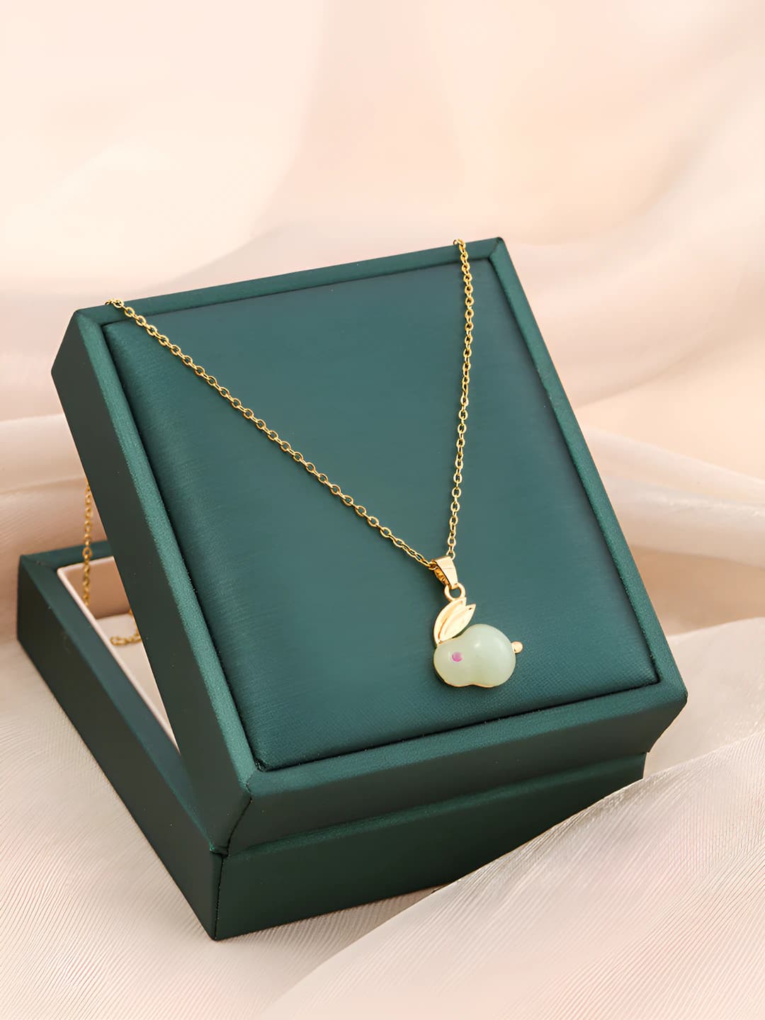 Gold, green stone rabbit