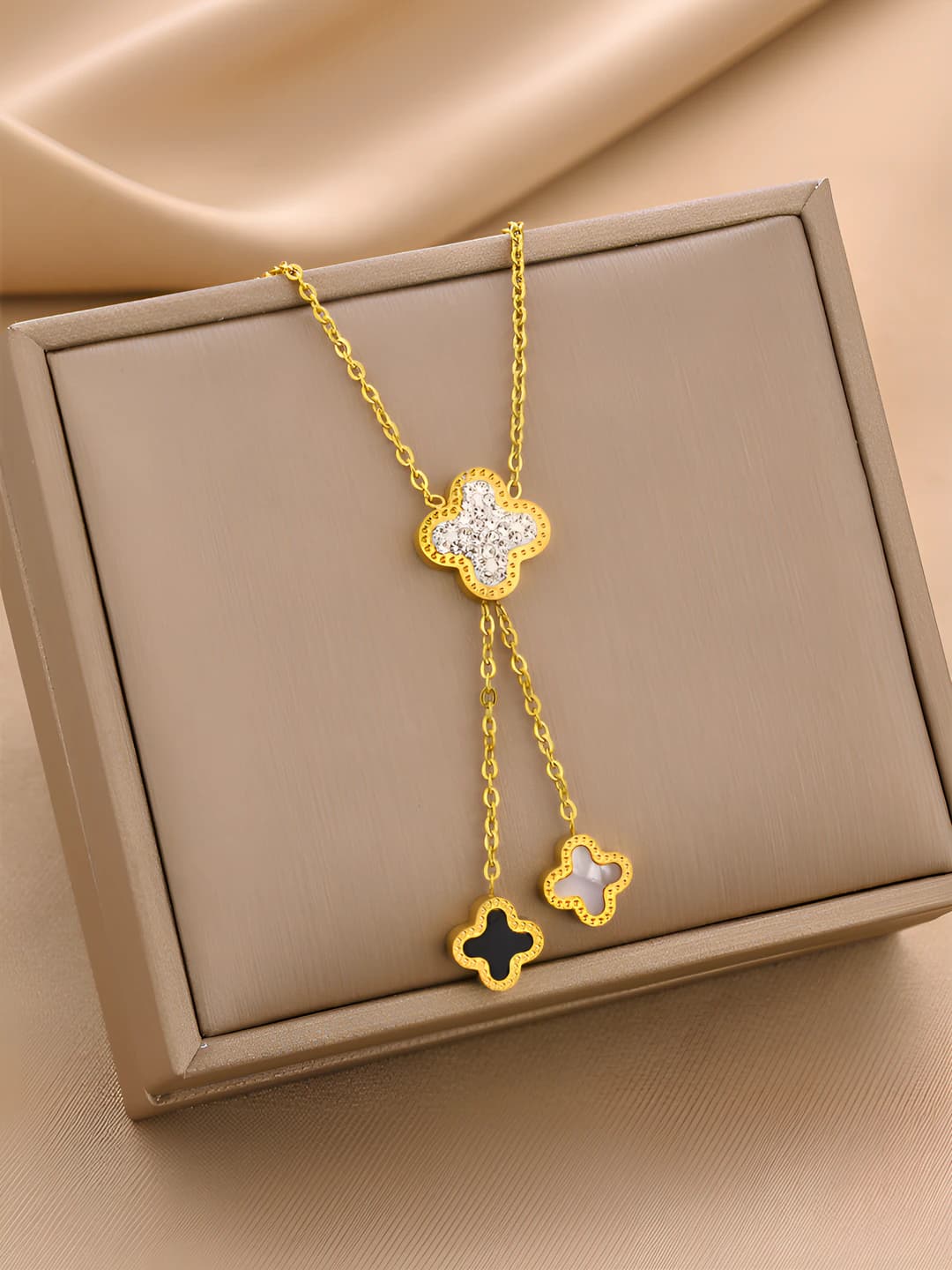 Women's titanium steel necklace with four-leaf clover and tassel pendant