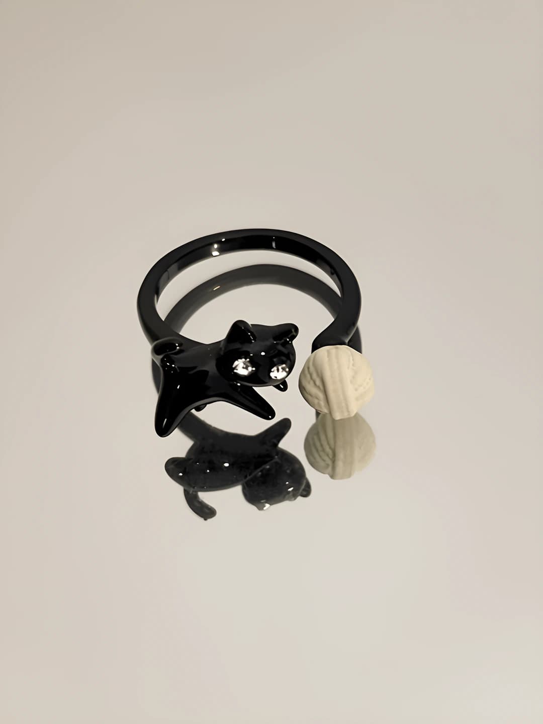 Cat and pom-pom ring