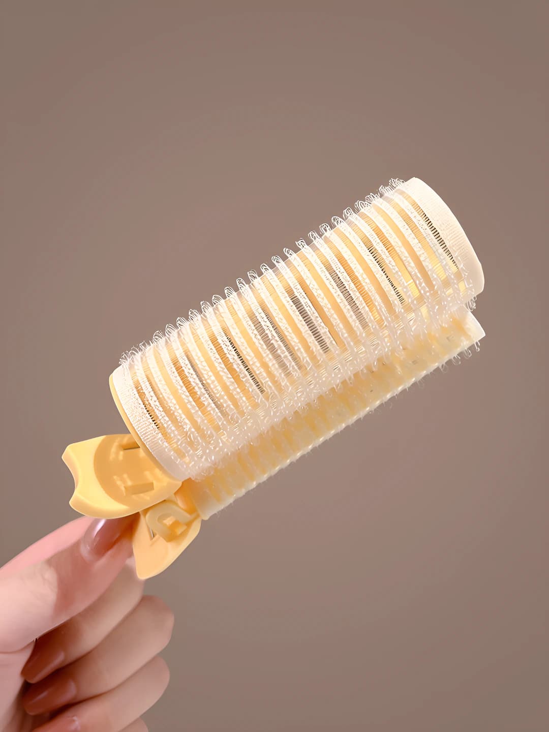 Yellow curler, ~10.5 cm