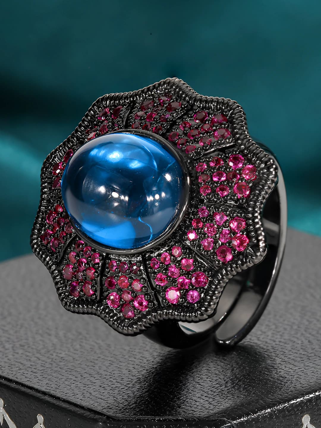 Black gold blue spinel ring