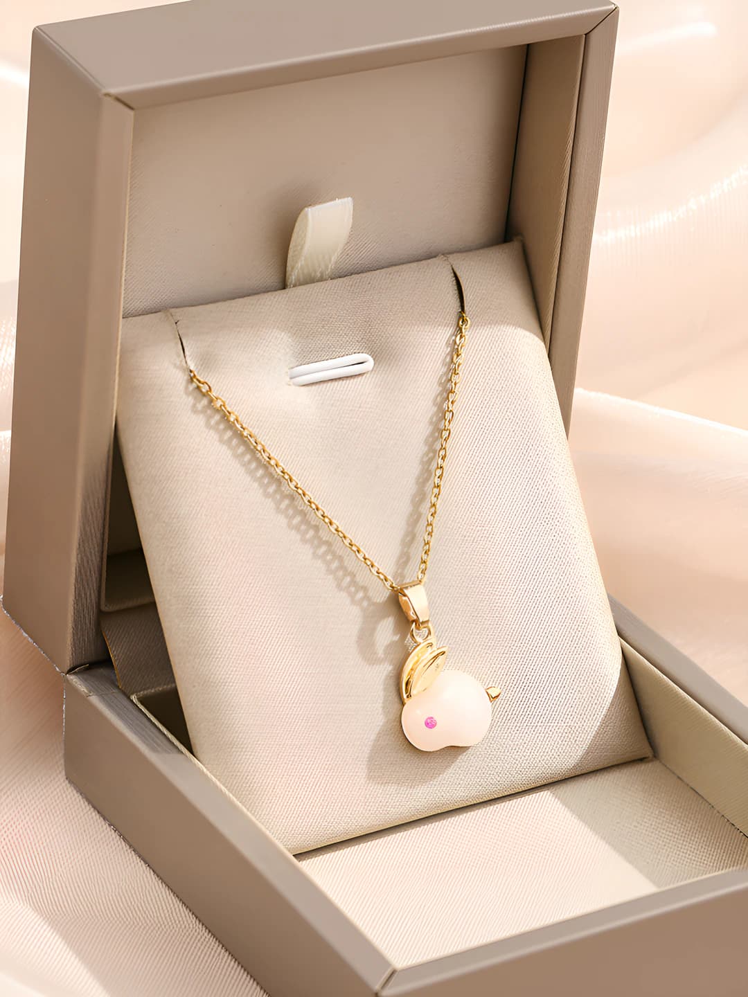 Gold, white stone rabbit