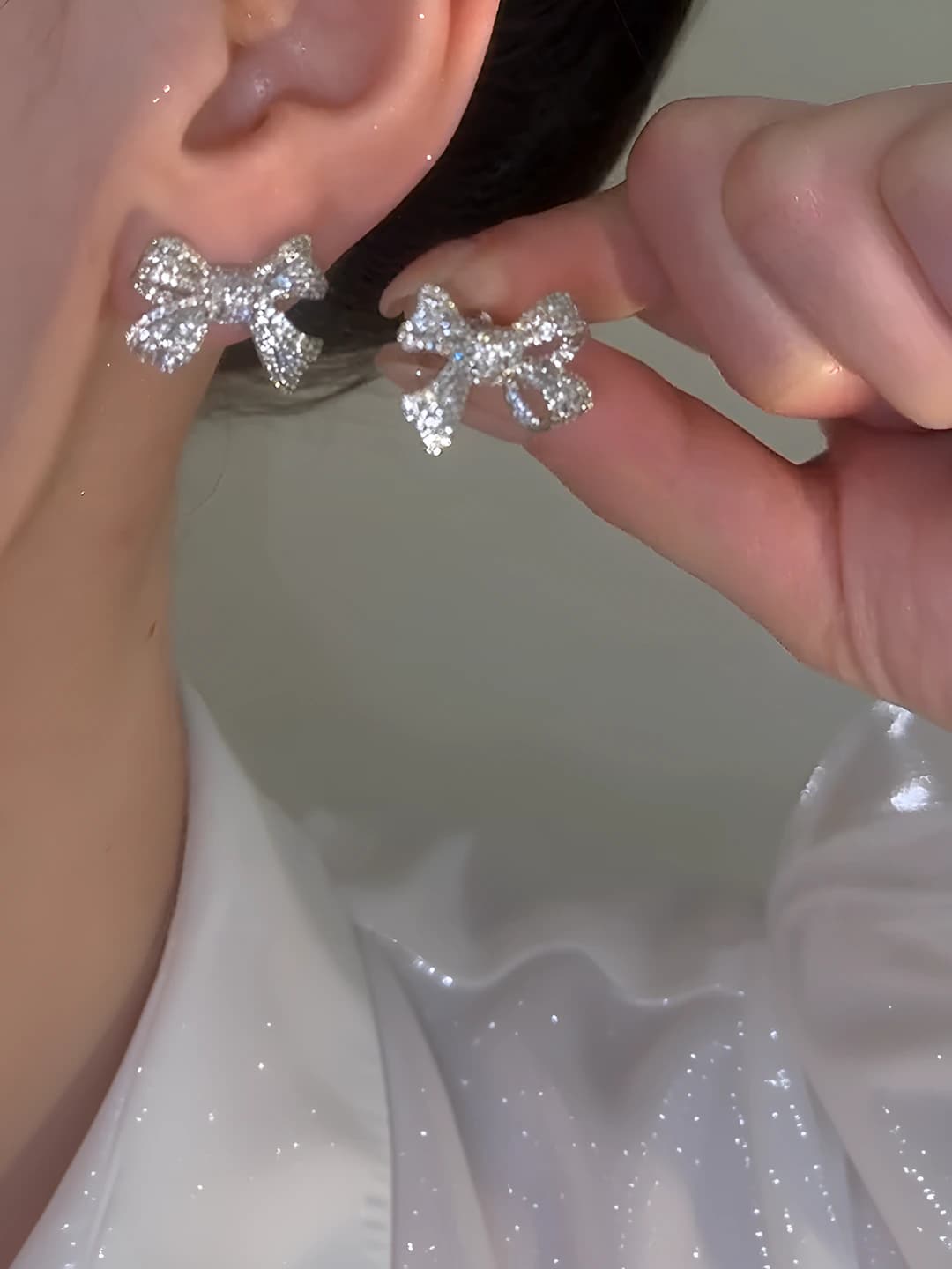 Women's bow zirconia stud earrings with silver posts