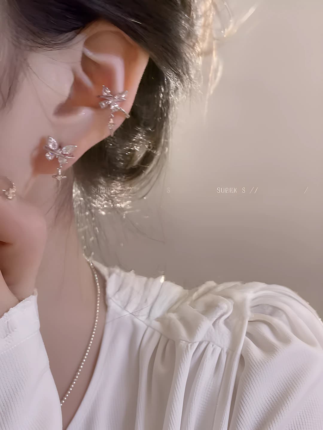 Butterfly star earrings pair