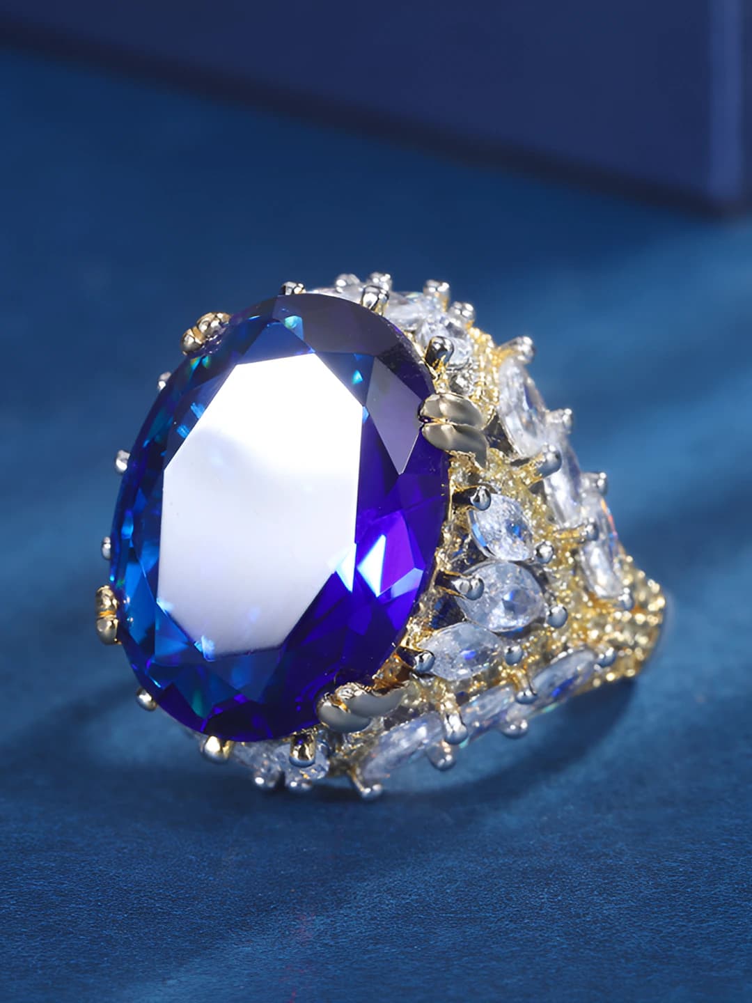 Women's brass ring with real gold plating, blue glass and crystals, geometric shape