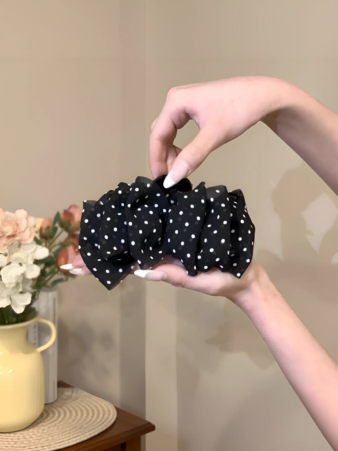 Black polka dot clip, base ~11 cm