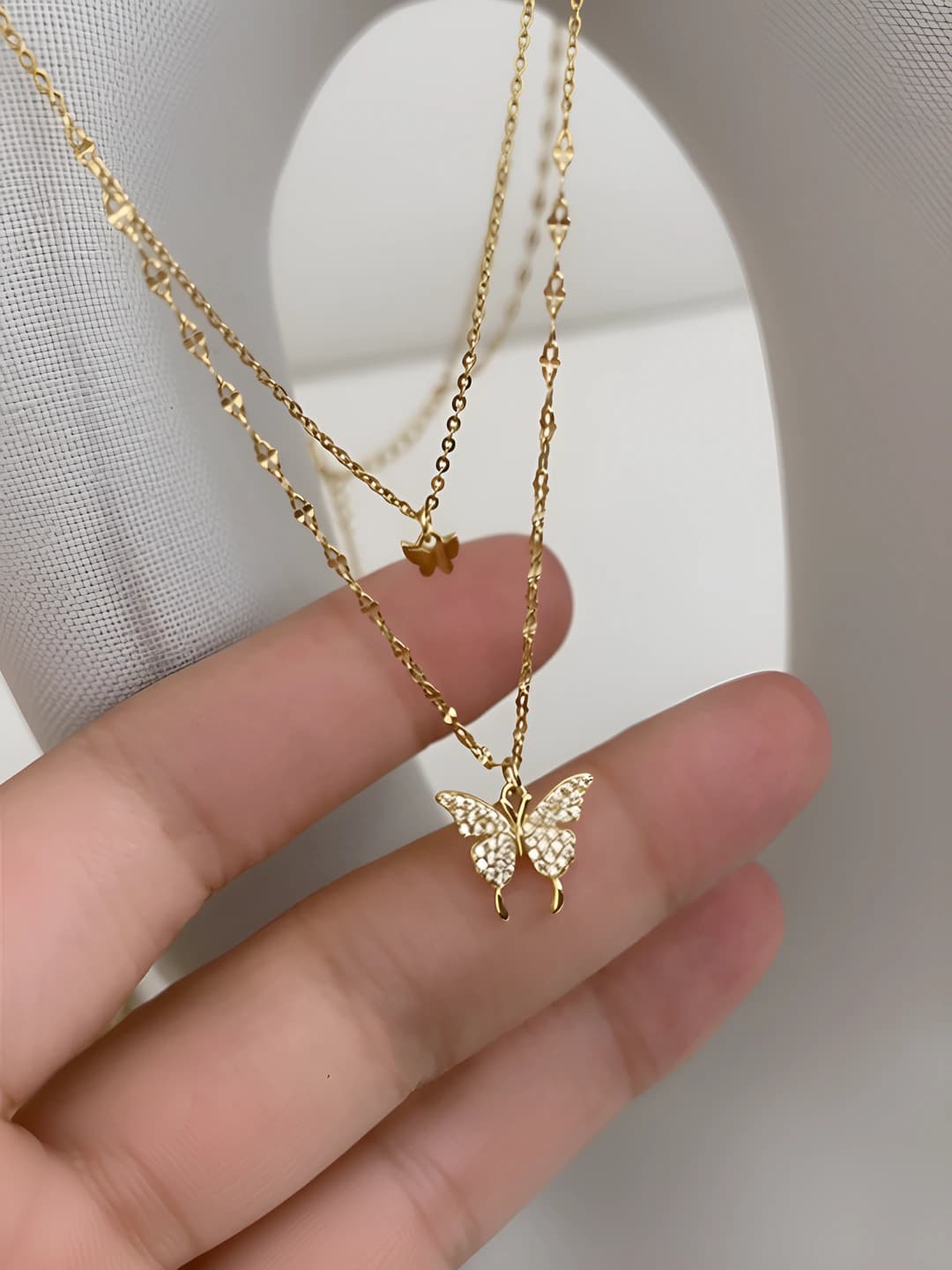 Gold double bow necklace