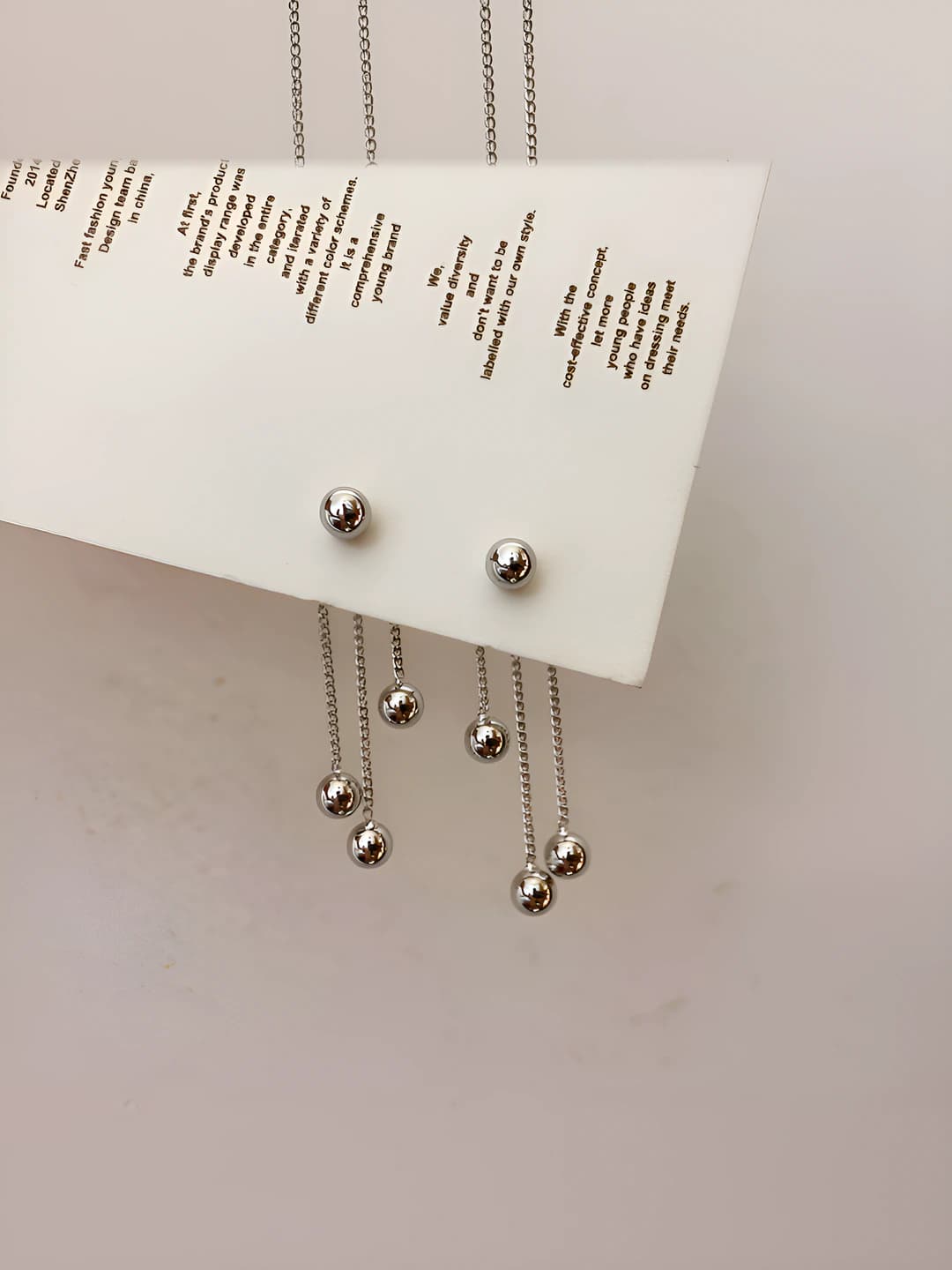 Silver ball tassels