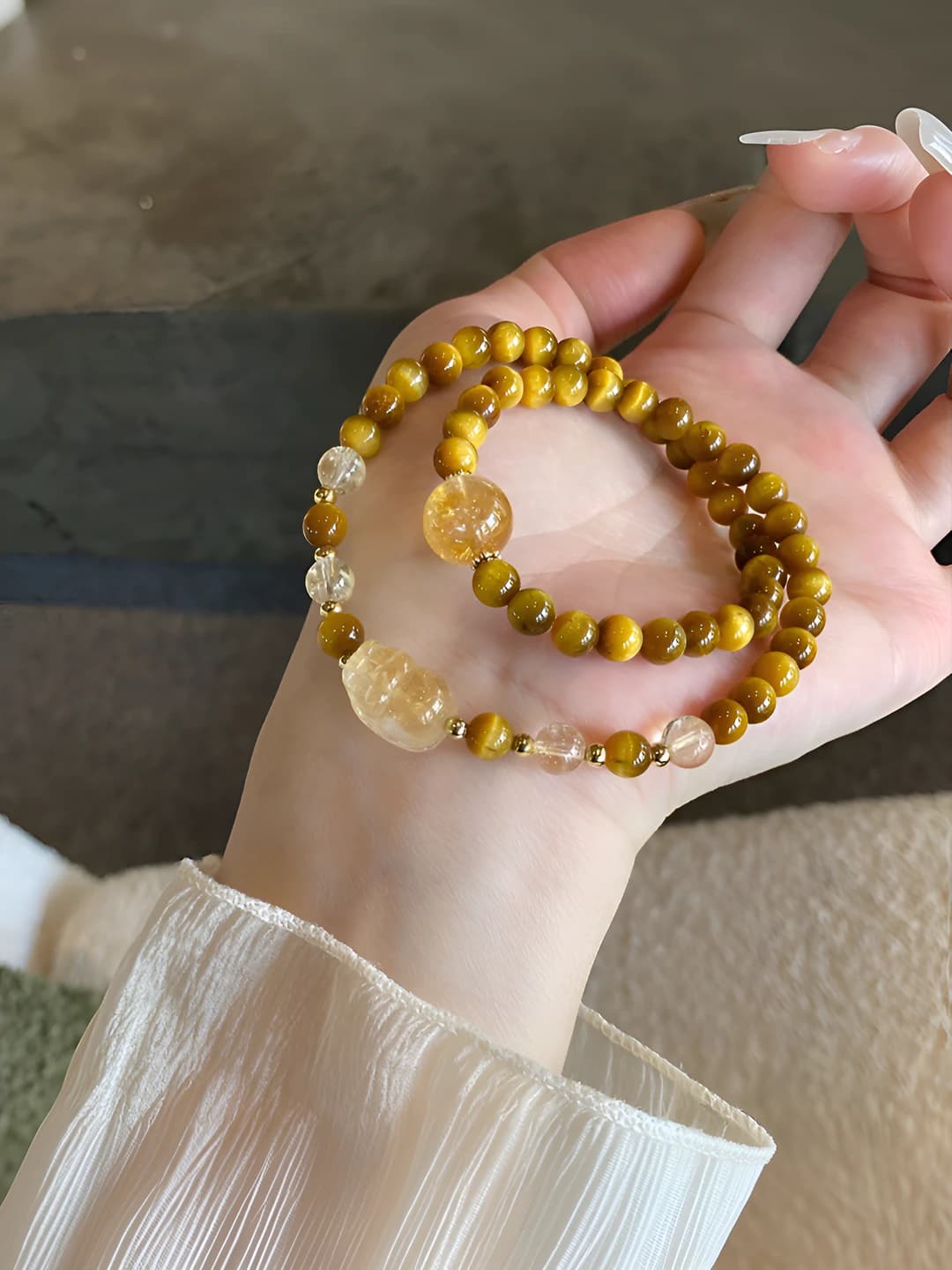 Women's double row artificial yellow crystal bracelet with pi-xi and gold tiger eye design