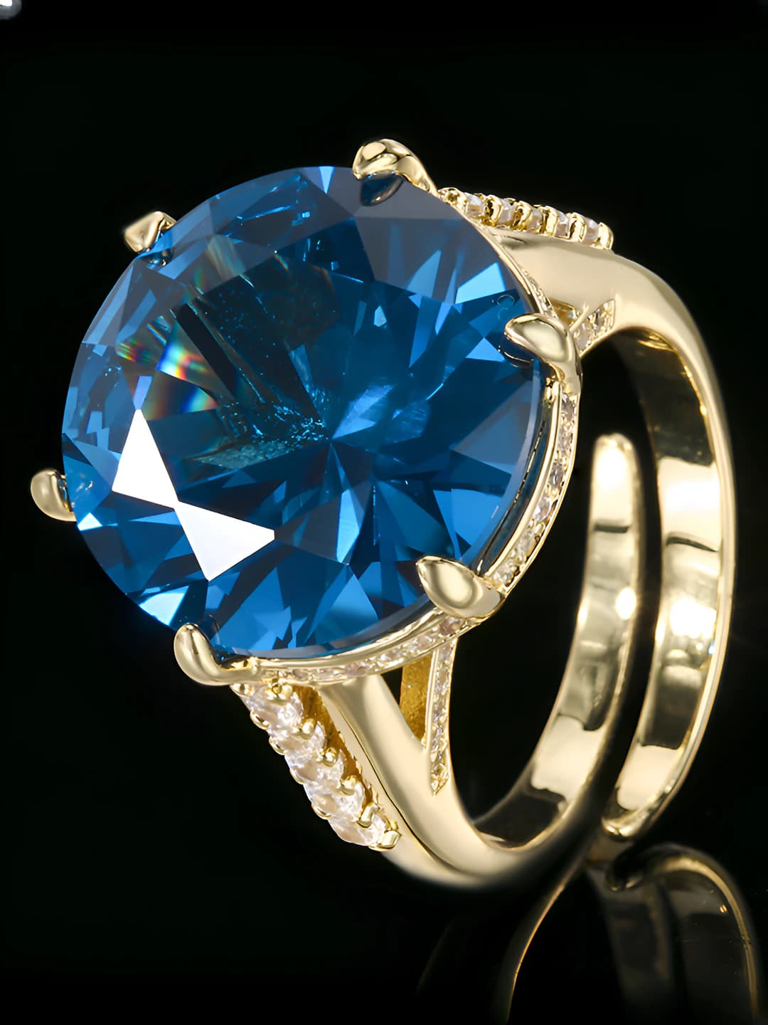 Women's retro ring 2026, round, 16 mm, brass with gold plating, with synthetic blue spinel and crystal inlays