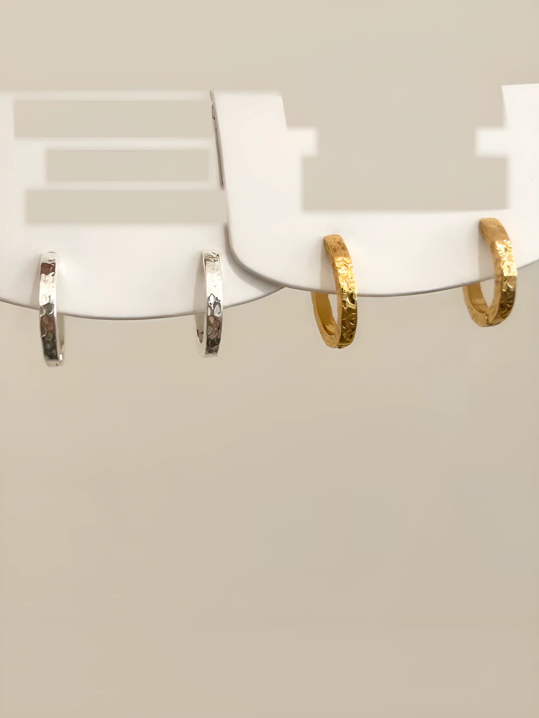Women's light luxury office earrings with geometric design, irregular texture, ring element and 18K plating