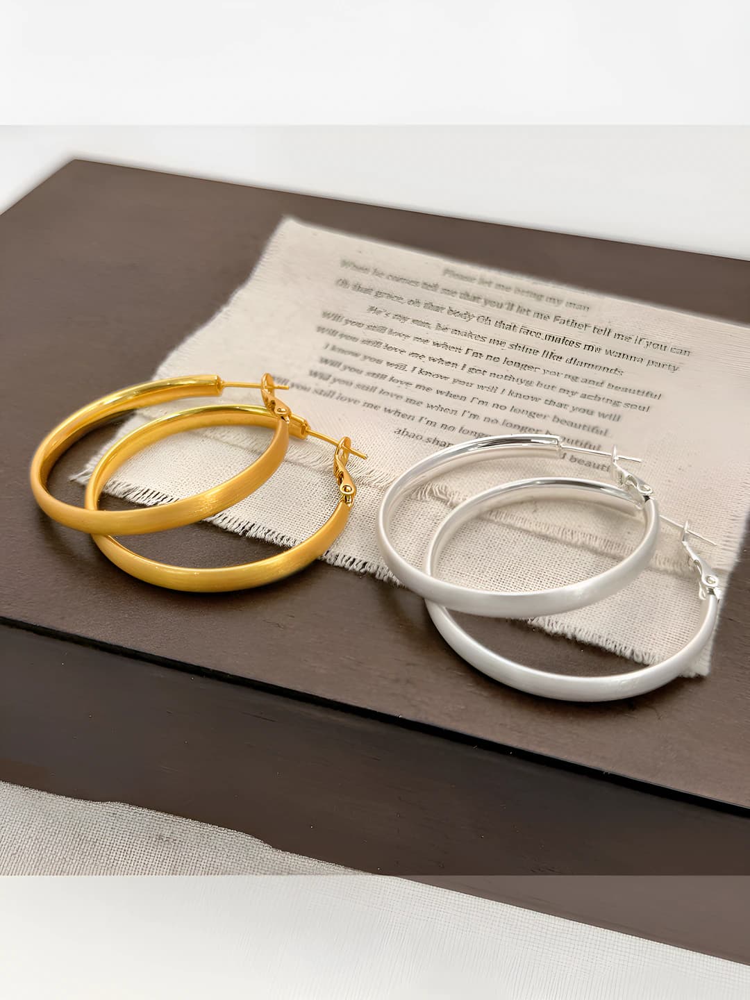 Women's geometric copper hoop earrings with matte 18k gold and silver plating