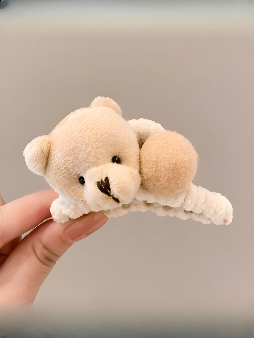 Small, beige, bear head