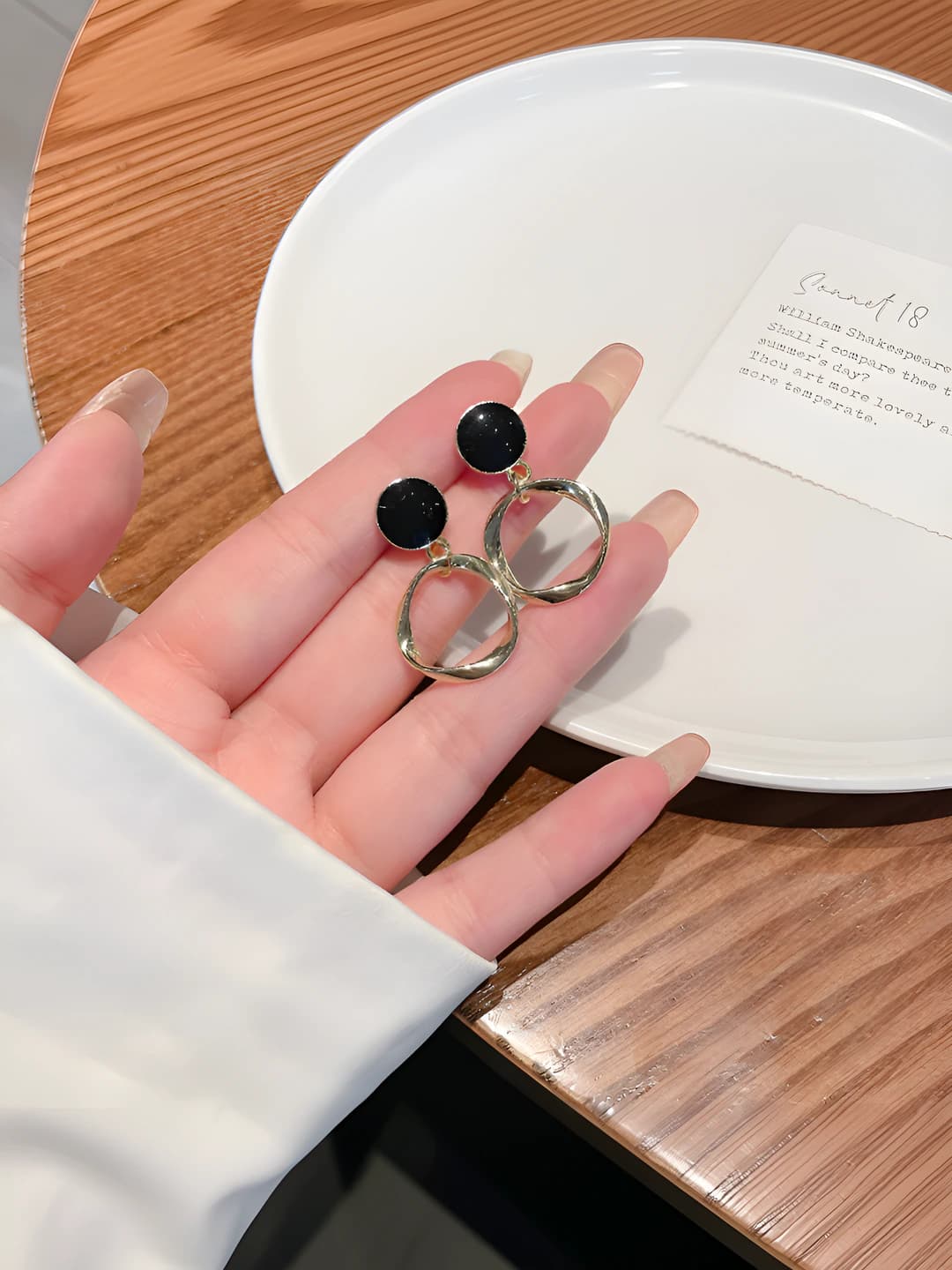 Black circle earrings, gold