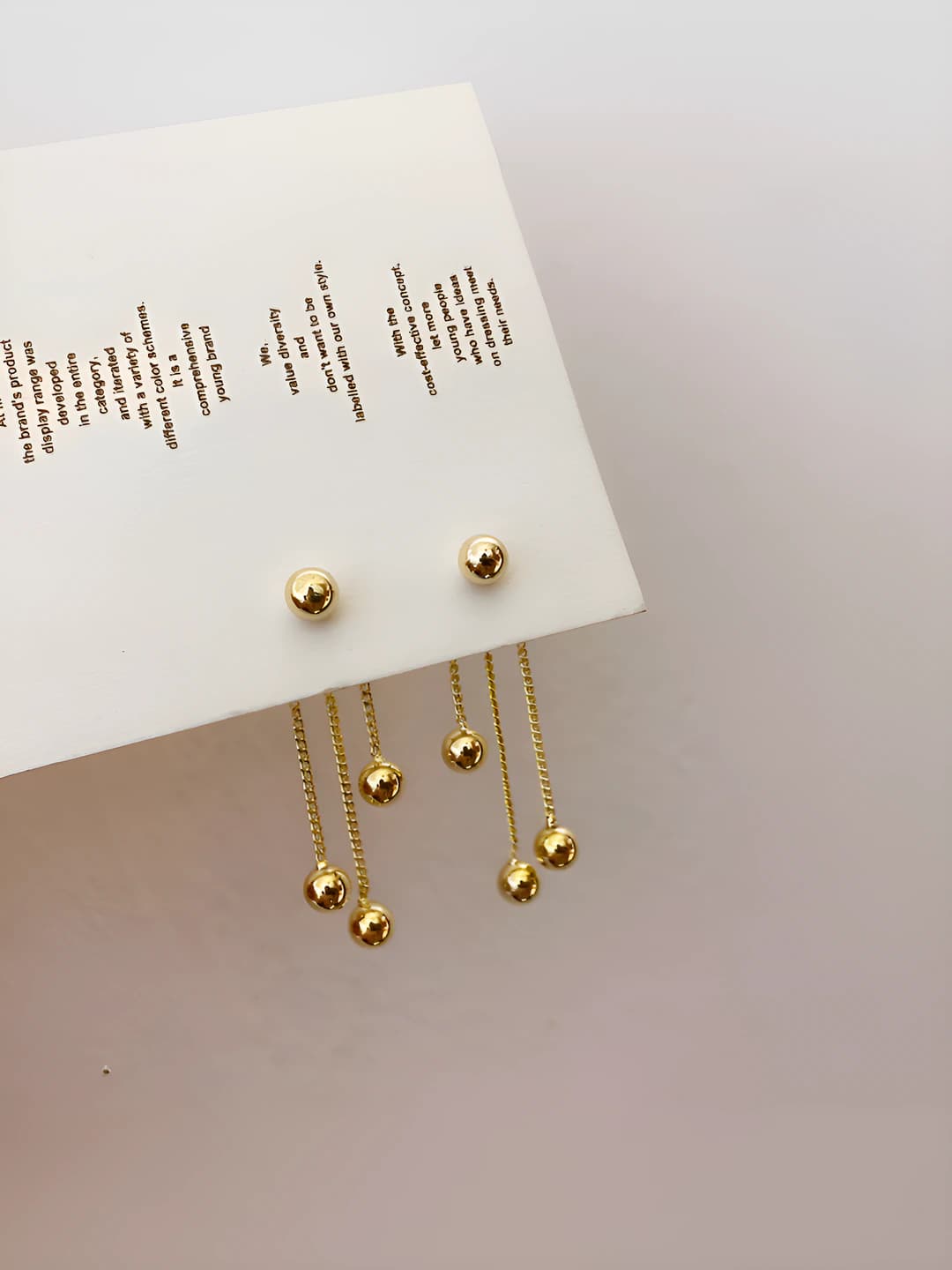 Women's earrings with metal balls and tassels, made of copper with real gold plating, ins style, individual and simple design element