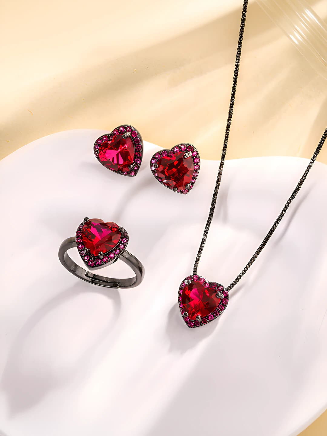 Women's 2026 set with simulated red ruby, heart shape, gold-plated copper base, black and gold color