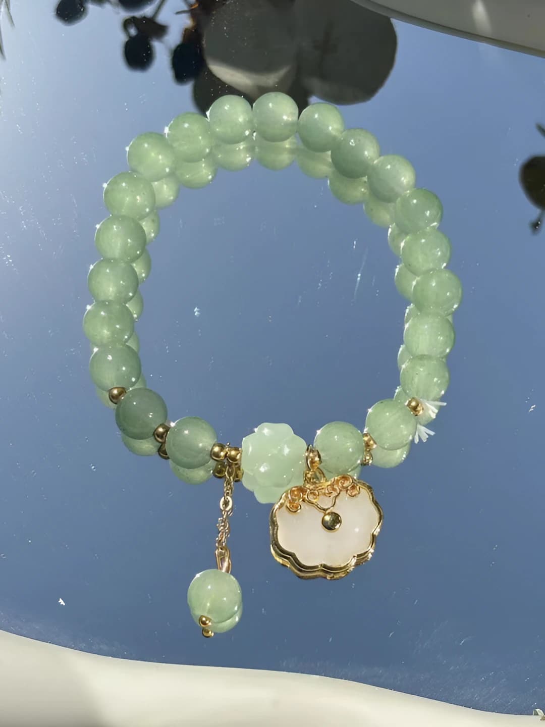 White safety lock, jade bracelet