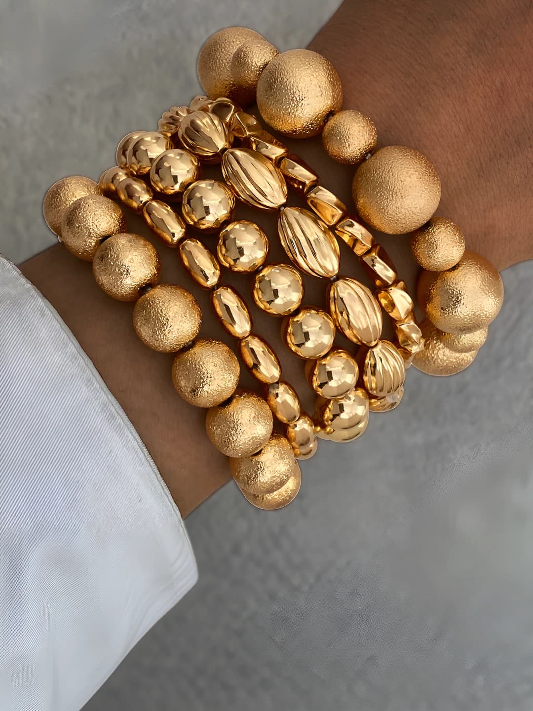 Women's geometric metal ball bracelet with brushed texture and irregular design